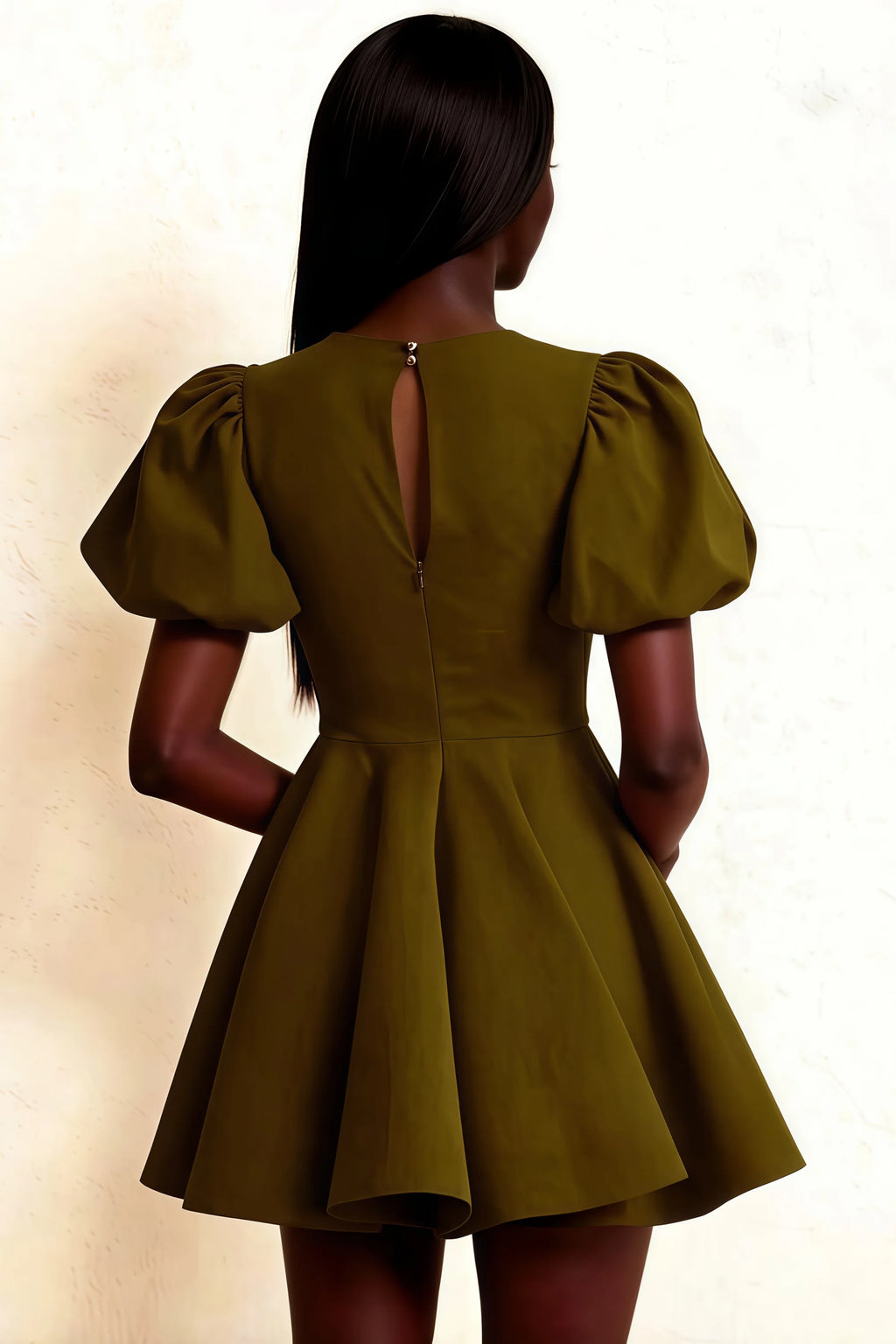 Elegant keyhole cutout at back of olive Celia dress, draped puff sleeves design, flowy A-line hem on model standing.