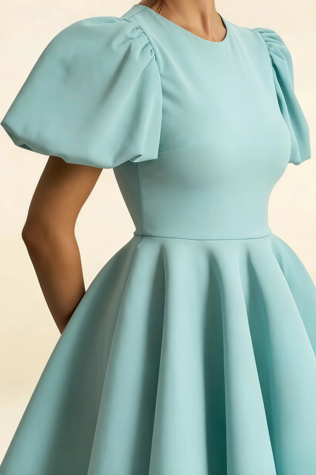 Detail of Celia Powder Blue Puff Sleeve Dress, Crew Neck and Puff Sleeve Design, Stretch Crepe Material Close - up, Perfect for Cocktail or Day Party, Elegant Mini Dress Feature
