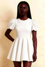 LVLVS Celia white stretch crepe crew neck puff sleeve mini dress front close up, fit and flare silhouette with puff shoulders, elegant casual wear
