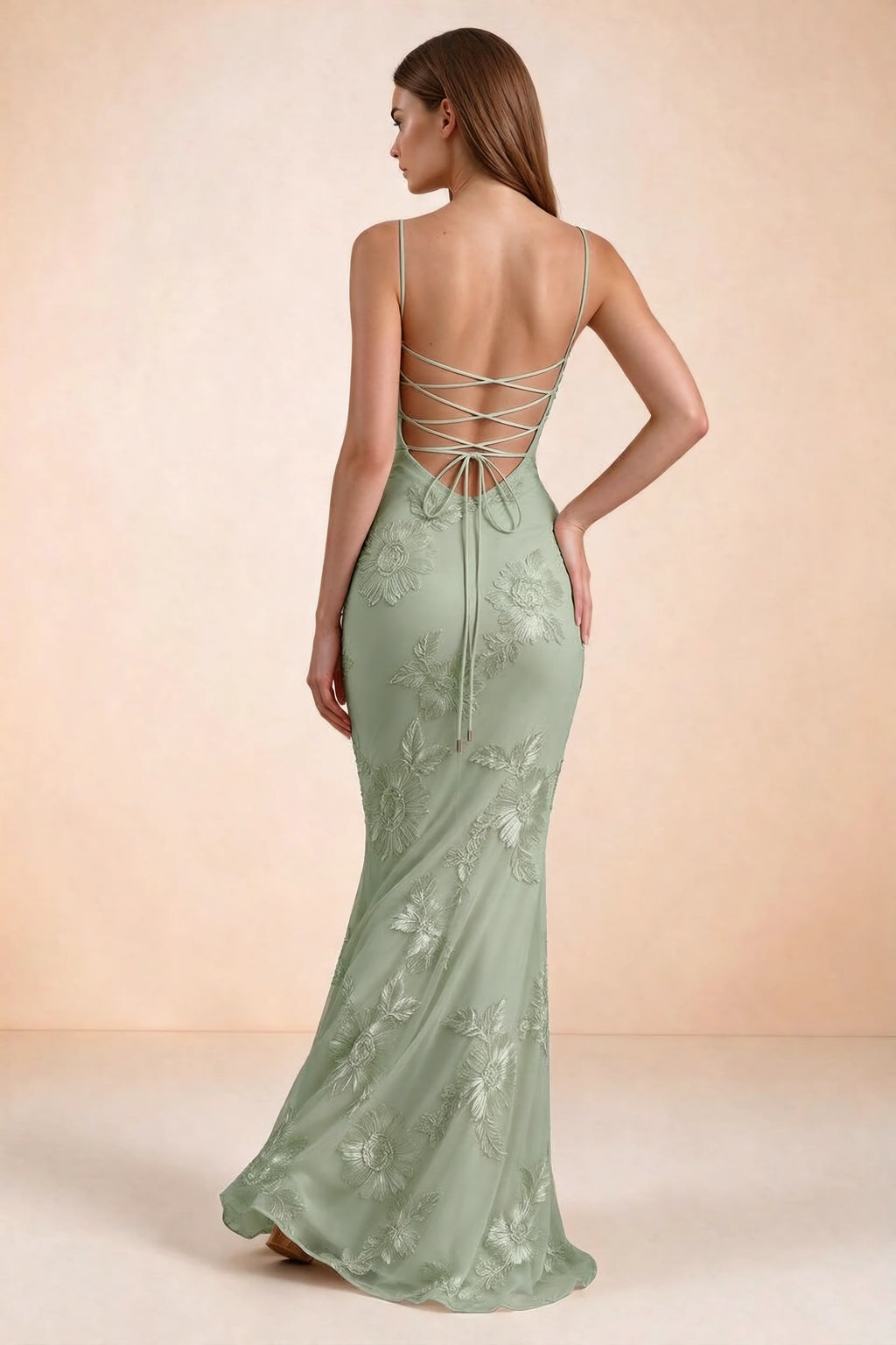 Rear studio view of Celine sage green floral embroidered corset mermaid maxi dress with a long flared hem