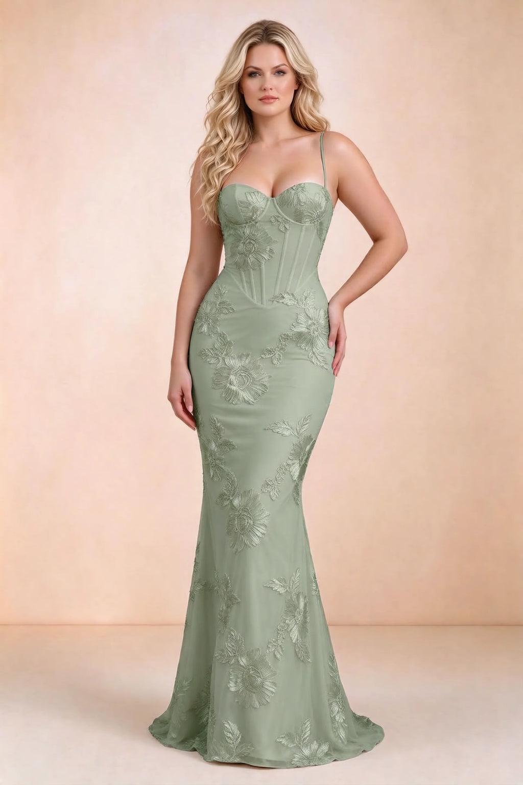 Front view on a second model of Celine sage green floral embroidered corset mermaid maxi dress with a long flared hem