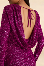 Macro shot of LVLVS Charlotte fuchsia sequin fabric and open back tie string, showcasing the intricate details and high-quality material of the mini dress.