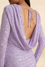 Detailed close-up of the LVLVS Charlotte dress back tie detail and luxurious sequin fabric texture, emphasizing unique design craftsmanship.
