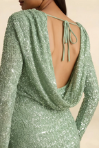 Extreme close-up of the back tie closure and intricate sequin pattern on the LVLVS Charlotte mint green long sleeve mini dress, a statement piece for cocktail hours.