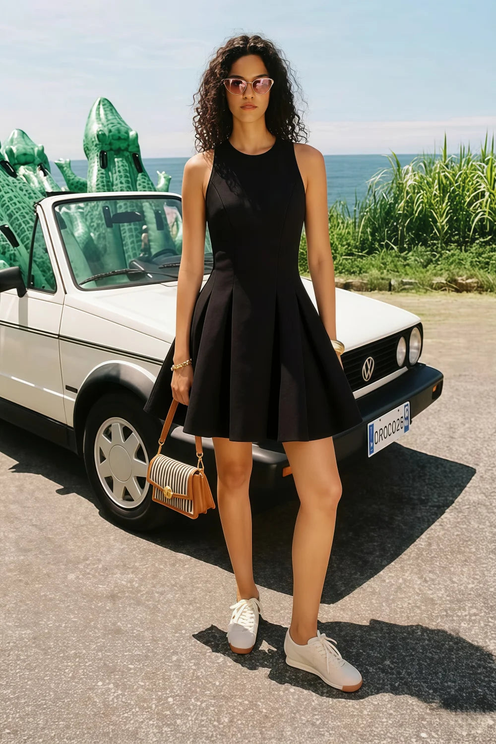 Real customer wearing Cheryl black sleeveless skater mini dress, casual chic style for daytime events, paired with white sneakers
