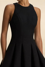 Textured crepe fabric detail of Cheryl black dress, high round neck design, sleeveless mini length for a sophisticated look