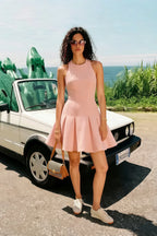 Customer photo of blush Cheryl dress worn for summer vacation, stylish round neck sleeveless skater mini dress perfect for holiday and outdoor events