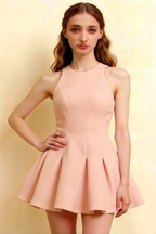 Close up front view of Cheryl blush dress showcasing princess seam detailing, form fitting round neck sleeveless skater mini dress in blush crepe