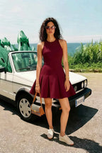 Customer photo of burgundy crepe Cheryl dress styled with sneakers, casual summer street style look.