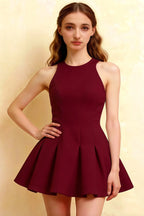 Elegant front close-up of burgundy sleeveless Cheryl dress, showcasing tailored bodice and flared skater skirt, cocktail attire.