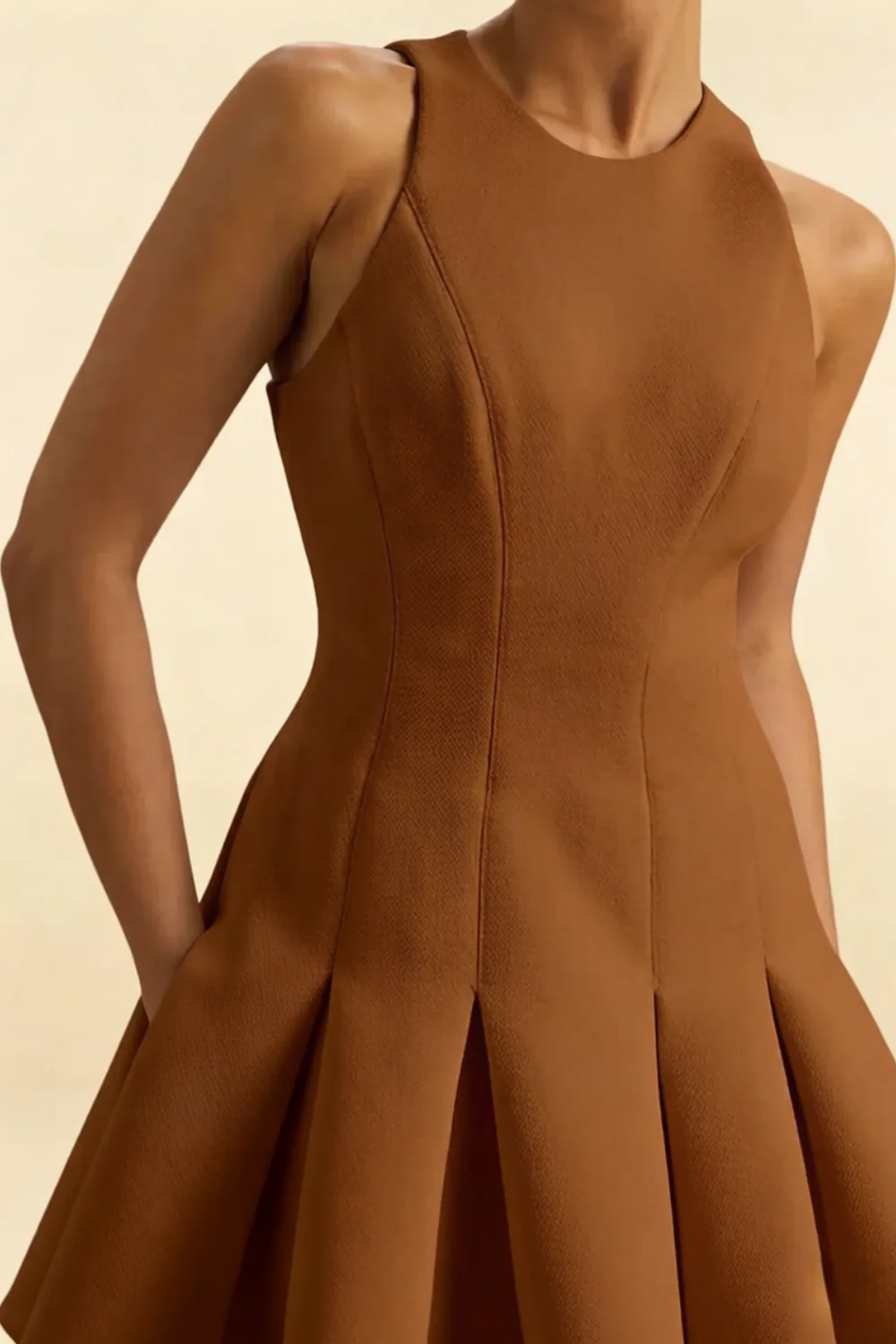Close-up bodice brown Cheryl dress coffee crepe round neck sleeveless skater mini dress, detailed stitching and tailored fit