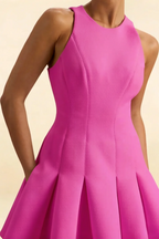 Close-up detail shot of the Cheryl fuchsia dress focusing on the high neckline, armholes, and bodice stitching, showcasing the quality crepe fabric and tailored design for a polished look.
