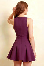 Rear view of plus size model wearing the Grape crepe Cheryl skater dress, emphasizing the comfortable fit and elegant back profile.