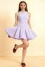 Elegant lavender Cheryl crepe dress, round neck sleeveless skater mini dress for homecoming, semi - formal event, prom, bridesmaid party, flared skirt, fitted bodice, model posing playfully.