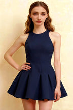 Close-up of the Cheryl dress highlighting the high-quality crepe fabric and tailored bodice. The round neck and sleeveless design offer a timeless semi-formal aesthetic.