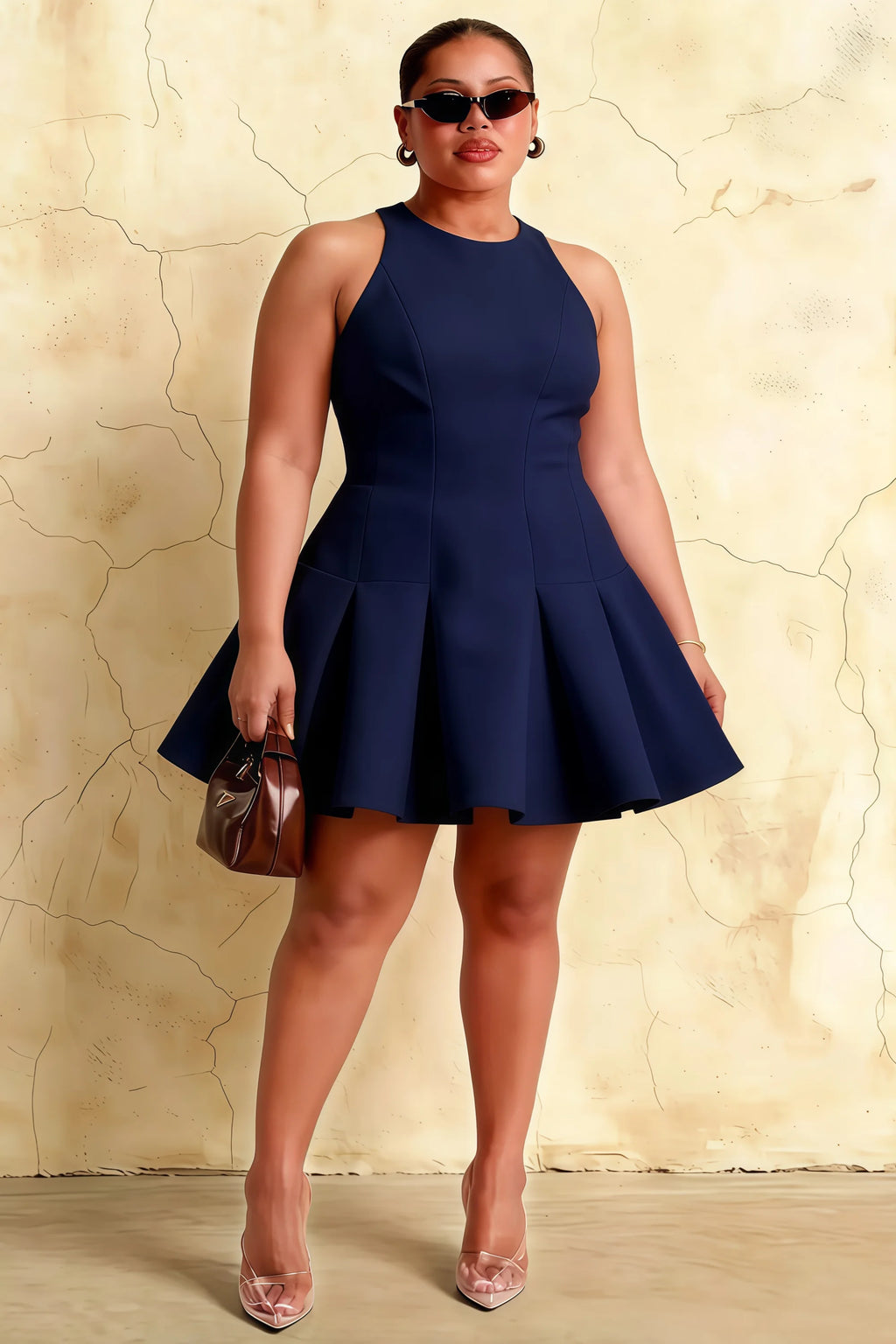 Plus size model slaying in the Cheryl navy blue skater dress. This inclusive design is perfect for curvy figures attending proms, galas, or formal dinners.