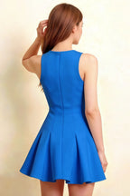 Detailed back view of Cheryl royal blue mini dress, highlighting fitted waist and pleated peplum skirt, sleeveless crepe fabric for a polished look at bridesmaid or cocktail events