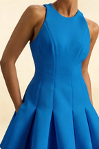 Close-up of Cheryl royal blue crepe dress bodice, featuring princess seams and smooth drape, round neck sleeveless design for a sleek, modern look at any semi-formal event