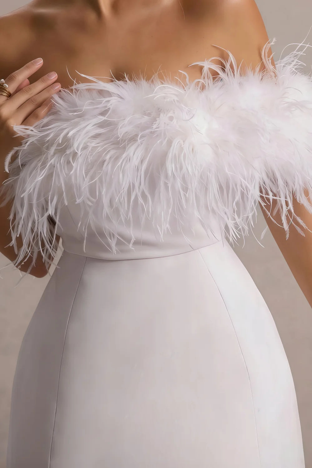 Close up of white feather trim on Chloe lavender strapless mini dress showcasing texture and material
