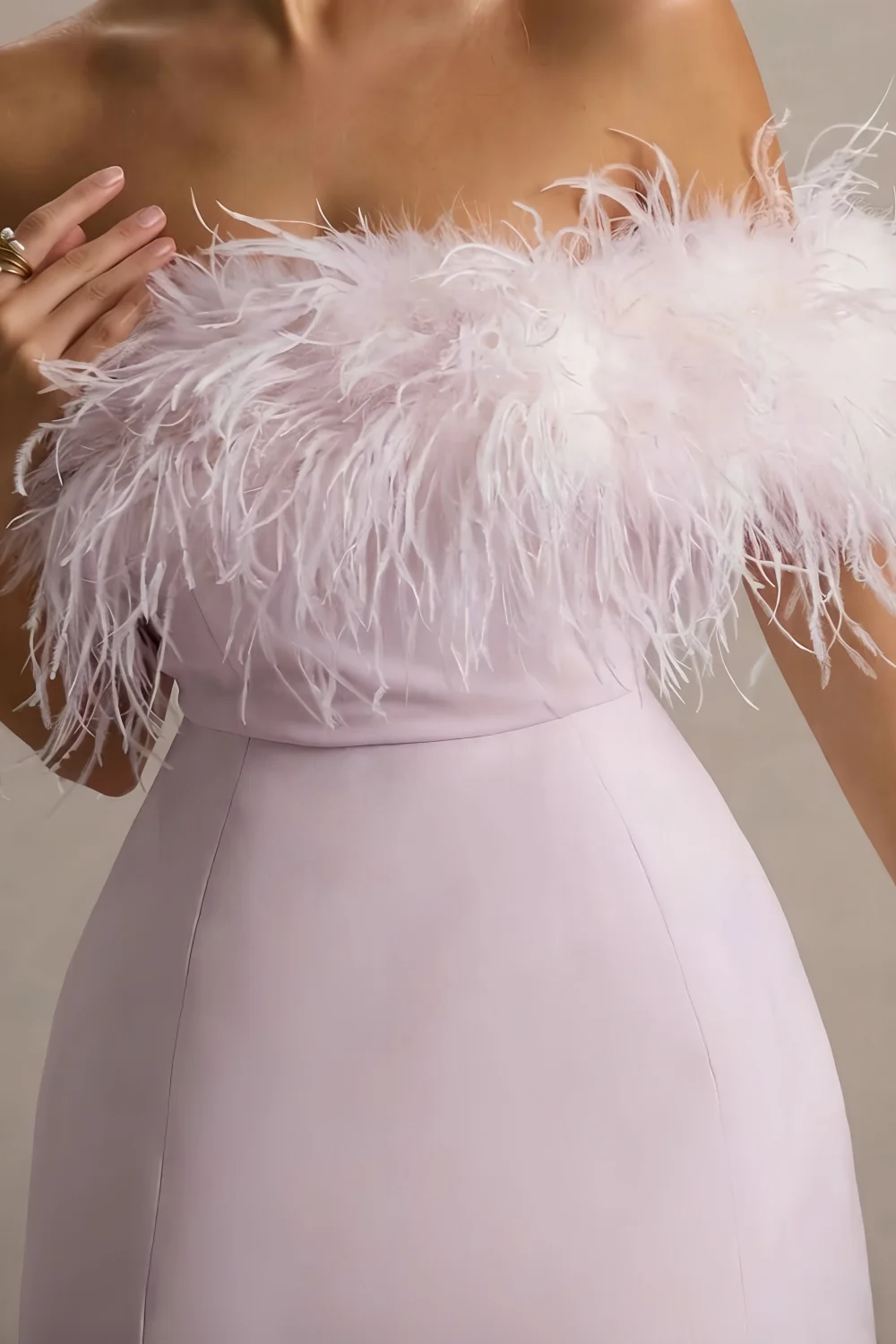 Close up of Chloe lilac strapless feather trim, soft crepe fabric & intricate feather detailing, luxury dress design
