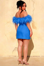 Back view of plus size woman wearing Chloe royal blue crepe dress with feather details, designed for bridesmaid parties and special occasions.