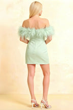 Back view of Chloe sage green crepe mini dress with off-shoulder feather detail for prom and cocktail parties