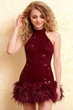 Close up of Christine burgundy sequin high neck sleeveless dress with feather trim, elegant semi-formal or party wear for women.