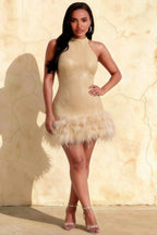 Plus size model wearing Christine champagne sequin high neck mini dress with feather trim, front view for inclusive fashion.