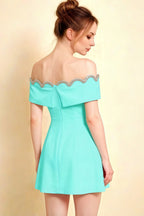 Side profile of Christy aqua crepe dress showing the zipper closure and elegant draping, ideal for semi-formal occasions.