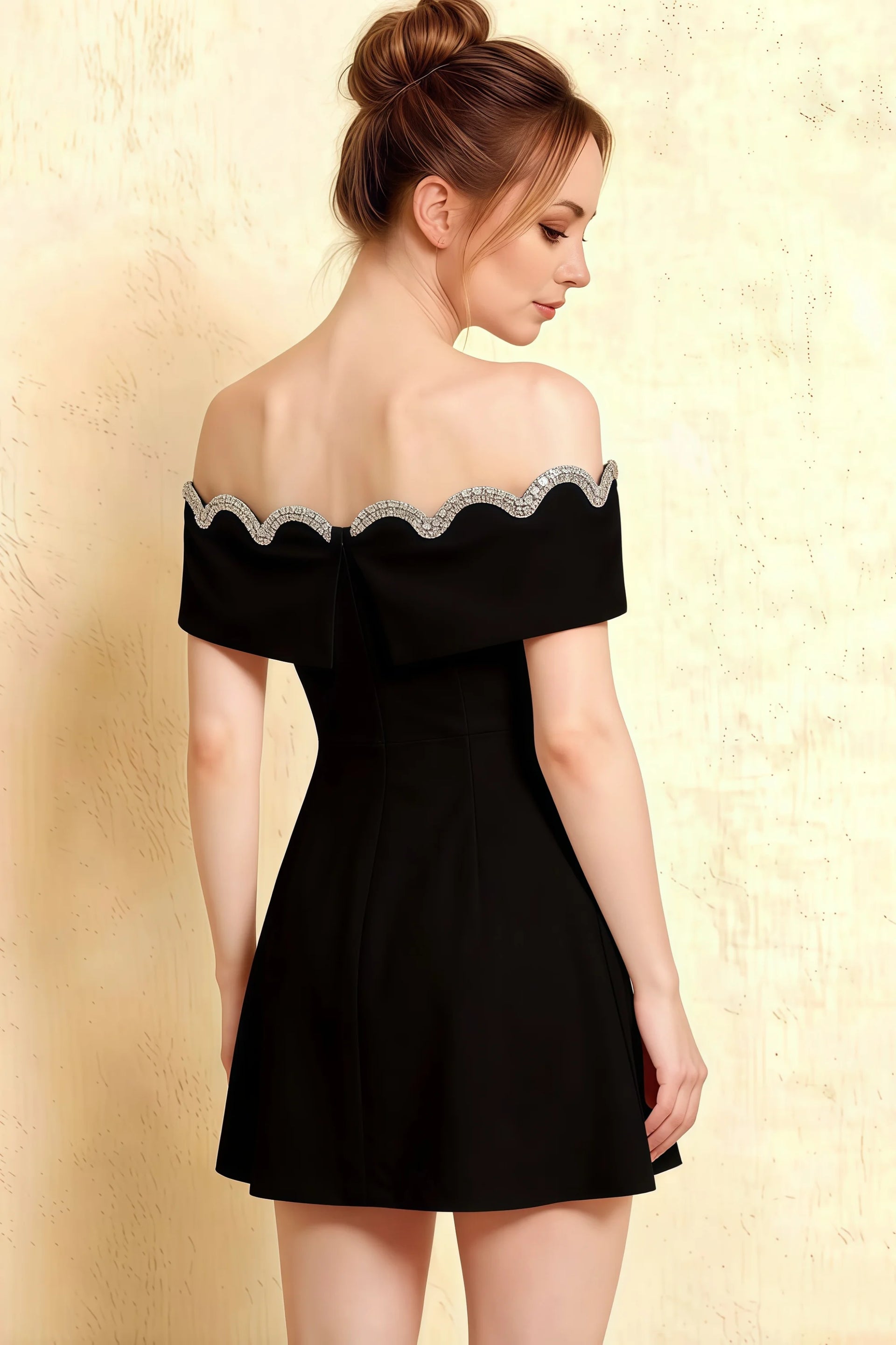 Cropped back view of the Christy black prom dress showing the elegant off-the-shoulder silhouette and fabric texture.