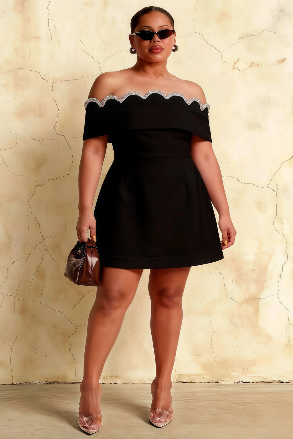 Plus size model wearing the Christy black crepe dress, perfect for curvy figures attending bridesmaid parties or formal dinners.