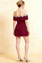 Back view of Christy Burgundy Crepe Mini Dress featuring a bow tie and off-shoulder rhinestone detailing for semi-formal events.