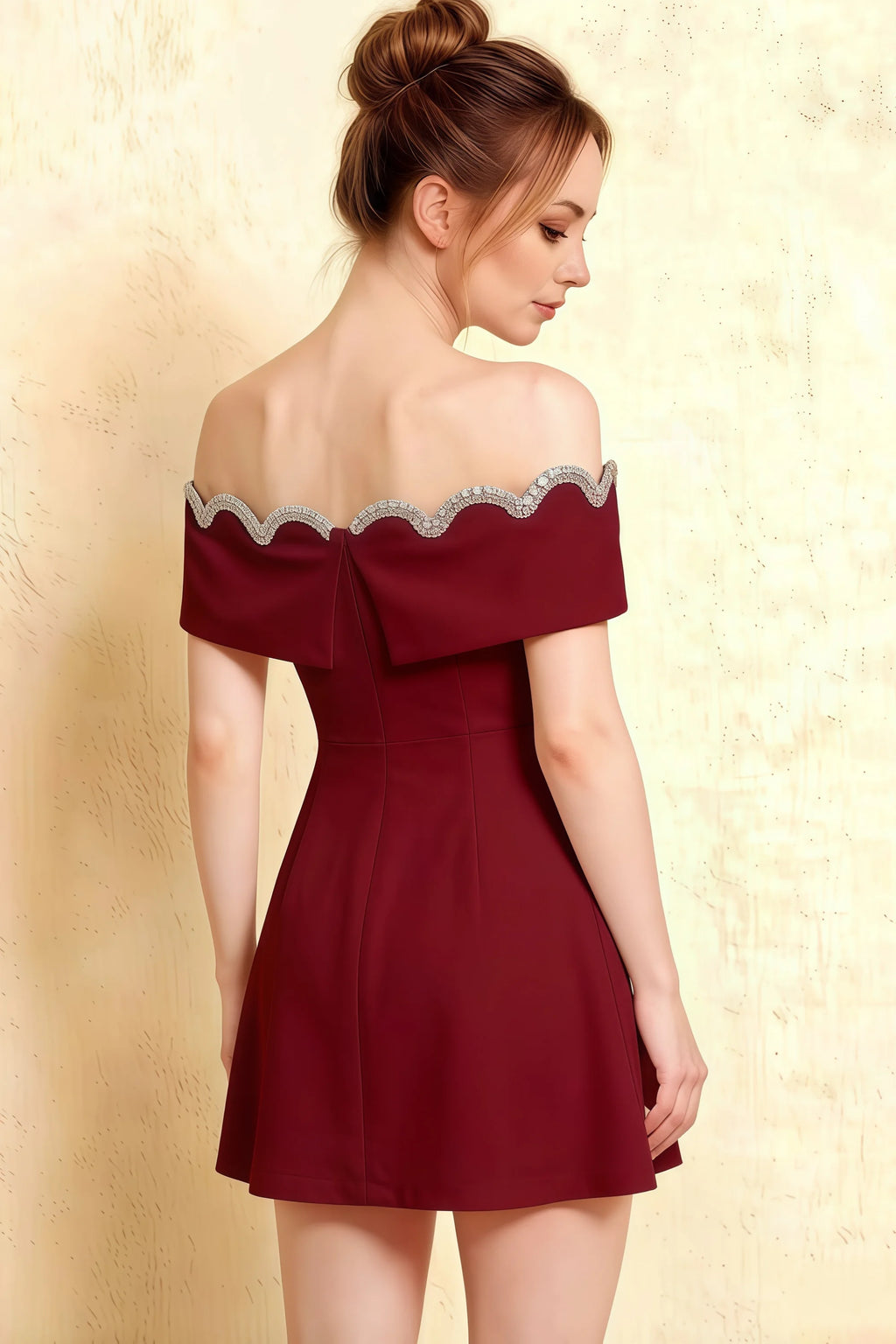 Detailed back view of Christy Burgundy dress highlighting the bow tie closure and elegant off-shoulder sleeve design.