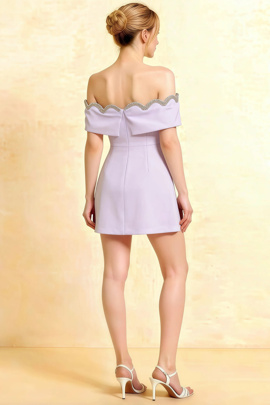 Back view of Christy lavender crepe cocktail dress with open back detail, short hemline, and crystal embellished trim.