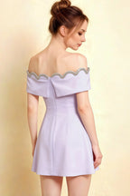 Elegant back shot of the Christy lavender off the shoulder dress, displaying the zipper closure and delicate rhinestone border.