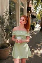 Real customer wearing Christy mint rhinestone mini dress outdoors, perfect as a summer street style look or for semi-formal garden parties.