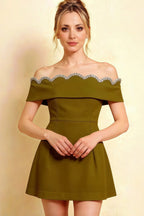 Detailed close-up of olive christy dress showcasing rhinestone sweetheart neckline and fit-and-flare silhouette.