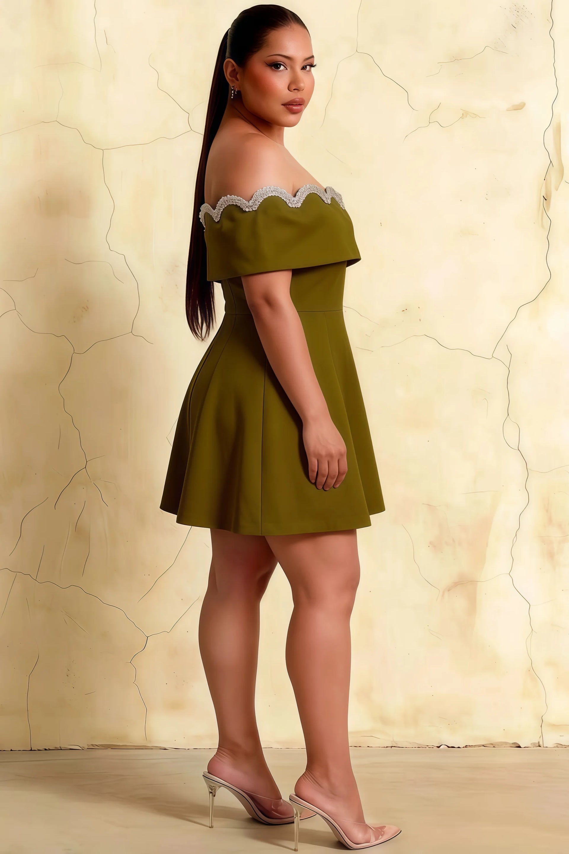 Side view of plus size olive crepe dress, showcasing comfortable fit and elegant A-line skirt.