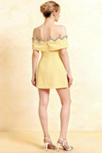 Back view of Christy pastel yellow off shoulder dress featuring adjustable zipper closure and scalloped lace trim.