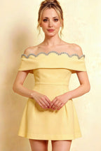 Close up of Christy pastel yellow off the shoulder rhinestone mini dress perfect for prom and bridesmaid parties.