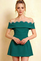 Christy Peacock Off-the-Shoulder Rhinestone Mini Dress – Studio shot showcasing the intricate rhinestone embellishment along the scalloped neckline. Perfect for semi-formal events or bridal showers.