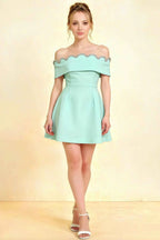 Christy mint blue off-the-shoulder mini dress with silver rhinestone trim, perfect for homecoming or semi-formal events, front view of model in studio.