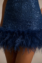 Close Up of Cindy Navy Sequin Dress with Feather Trim - Sequins and Feather Hem Detail
