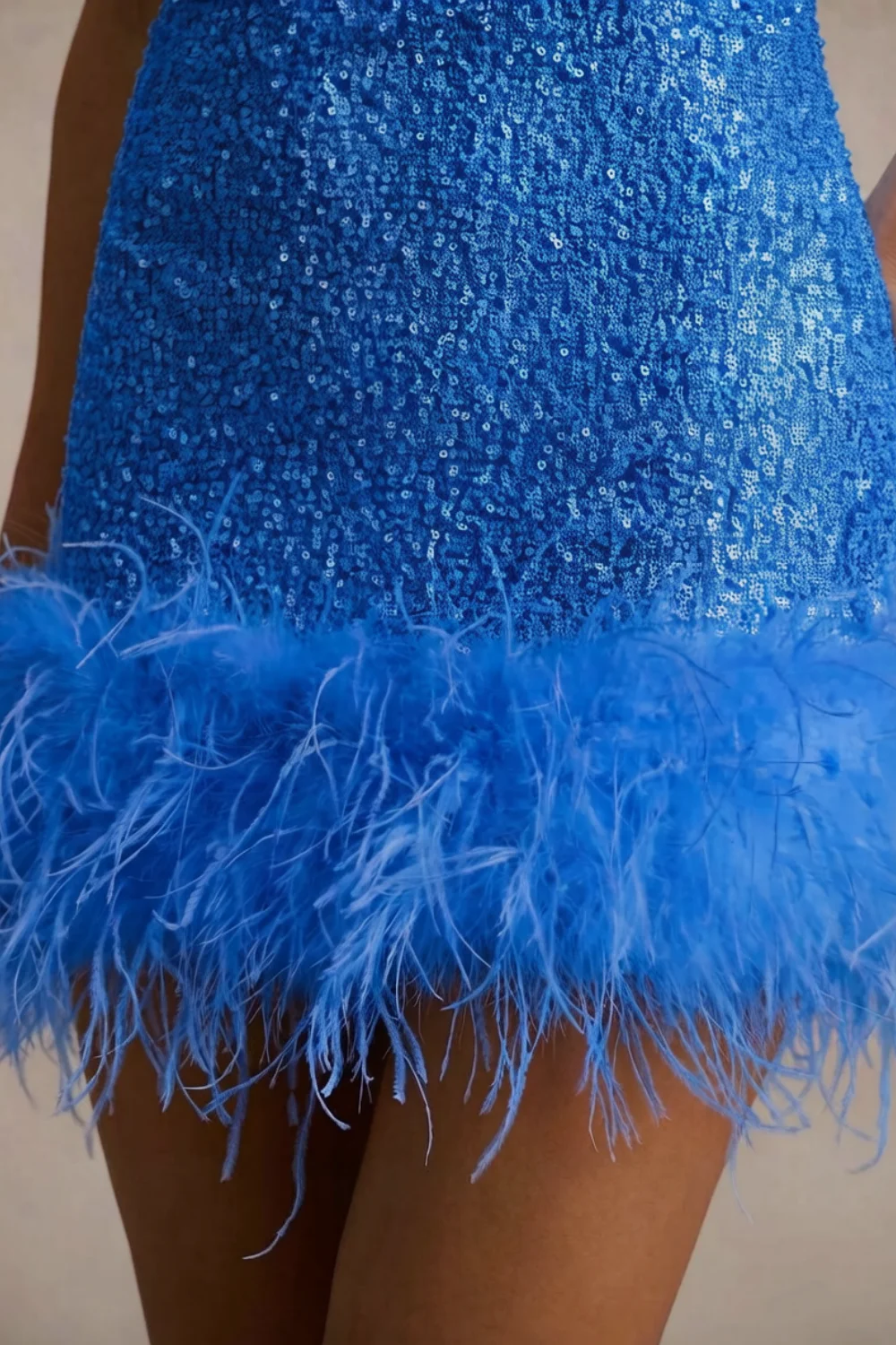 Close up of royal blue sequin fabric and feather trim on Cindy mini dress, luxury texture detail for prom and formal wear