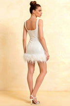 Back view of Cindy white sequin bodycon square neck mini dress with feather trim, showcasing open back design, perfect for prom.