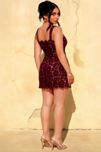 Plus size model back view wearing Claire burgundy lace A-line square neck mini dress, showcasing fit and open back design.