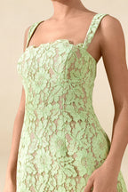 Close up detail of Claire light green floral lace square neckline and bodice texture.