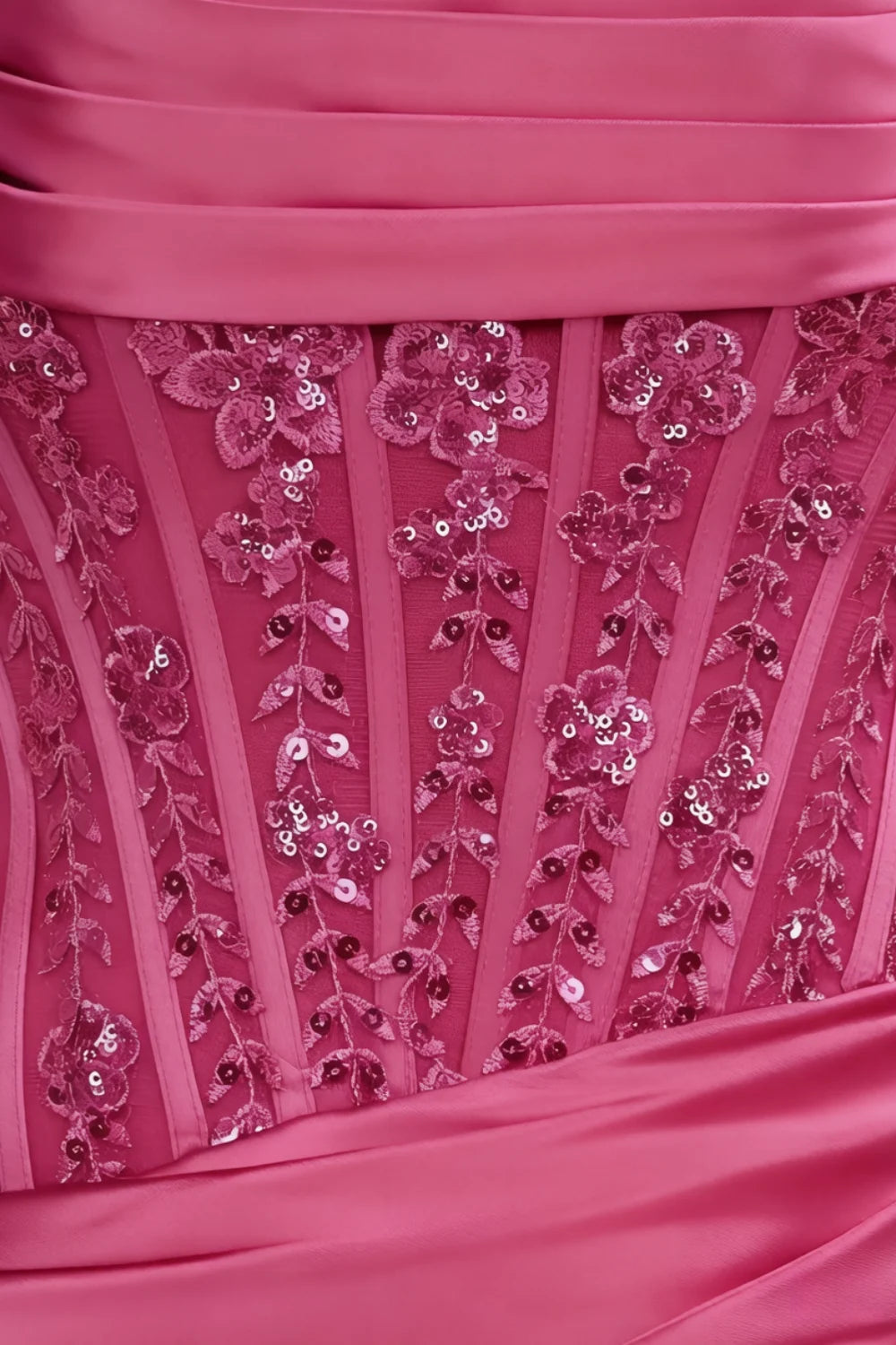 Close - up of Clara hot pink satin bodycon corset dress lace sequin embroidery detail