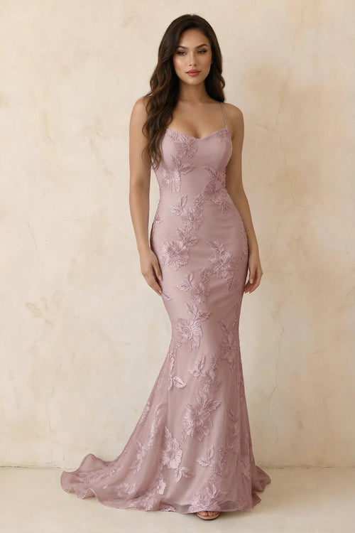 Three-quarter studio view of Cordelia dusty lilac floral appliqué lace-up mermaid maxi dress with a long flared hem