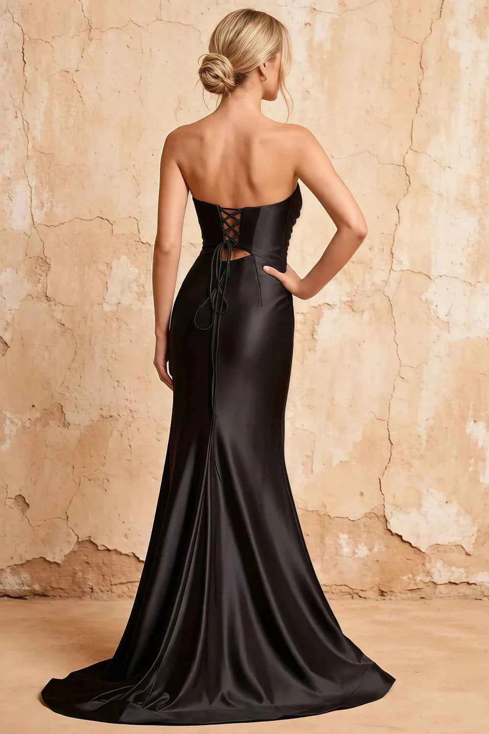 Translation missing: en.Full-length back view of the Karina black mermaid dress, showing the lace-up bodice and satin hem spreading across the floor. content.product_image_secondary